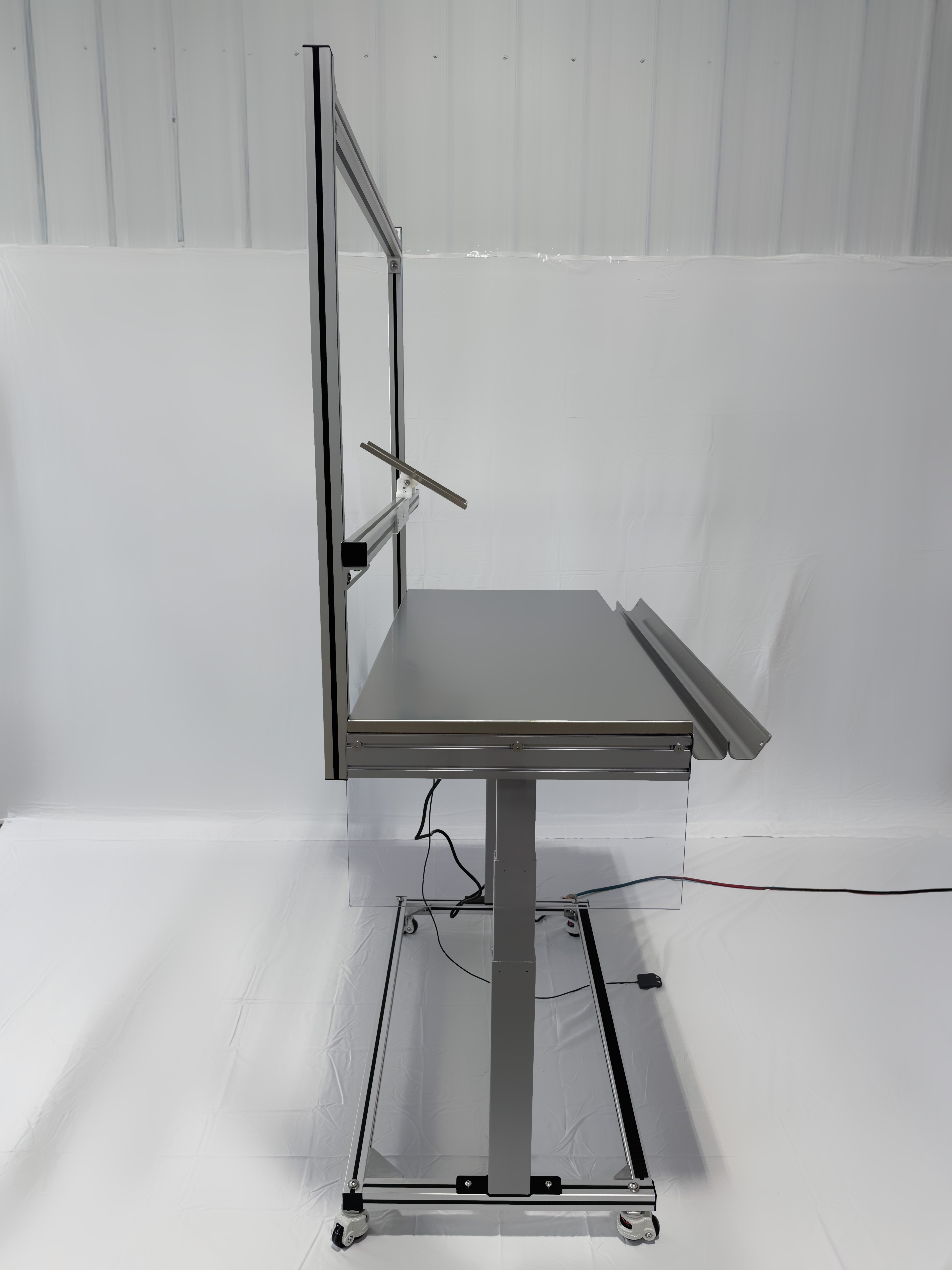 Side view of short desk with arms on workstation